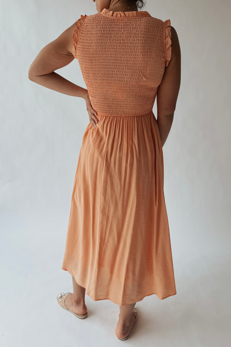 The Cordova Smocked Detail Midi Dress in Light Orange Piper & Scoot The Cordova Smocked Detail Midi Dress in Light Orange Piper & Scoot