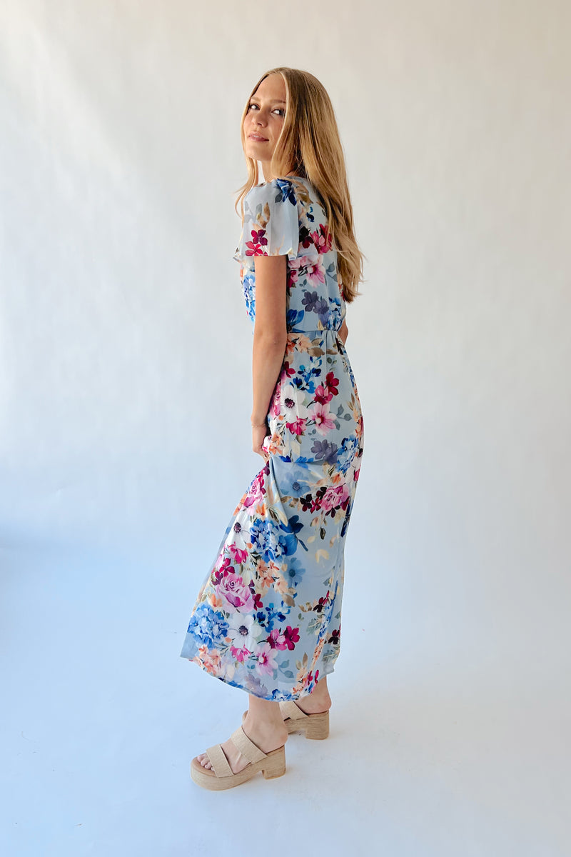 The Camille V-Neck Flutter Sleeve Maxi Dress in Blue Floral Piper & Scoot The Camille V-Neck Flutter Sleeve Maxi Dress in Blue Floral Piper & Scoot