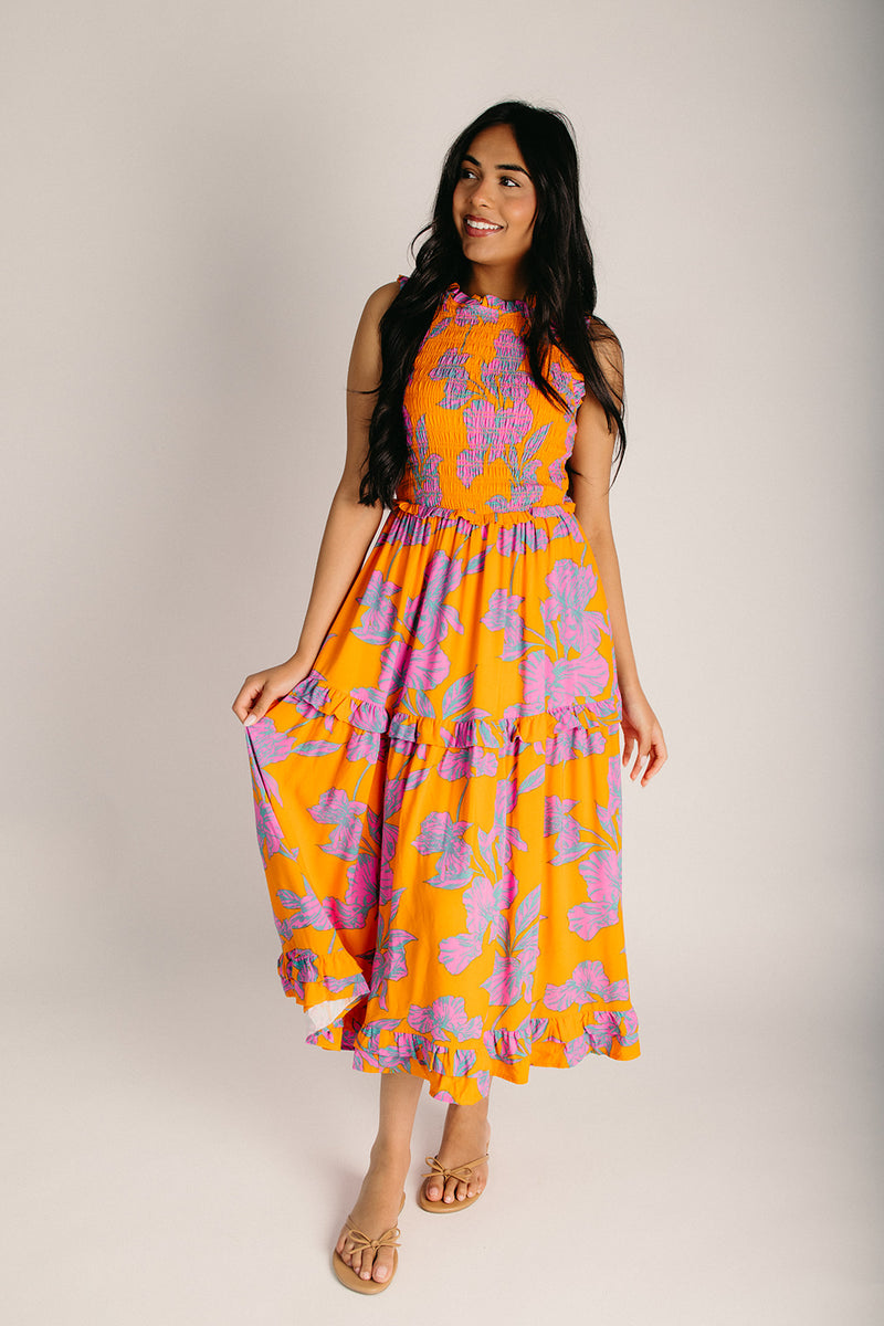 The Kathia Smocked Floral Midi Dress in Orange + Pink Small