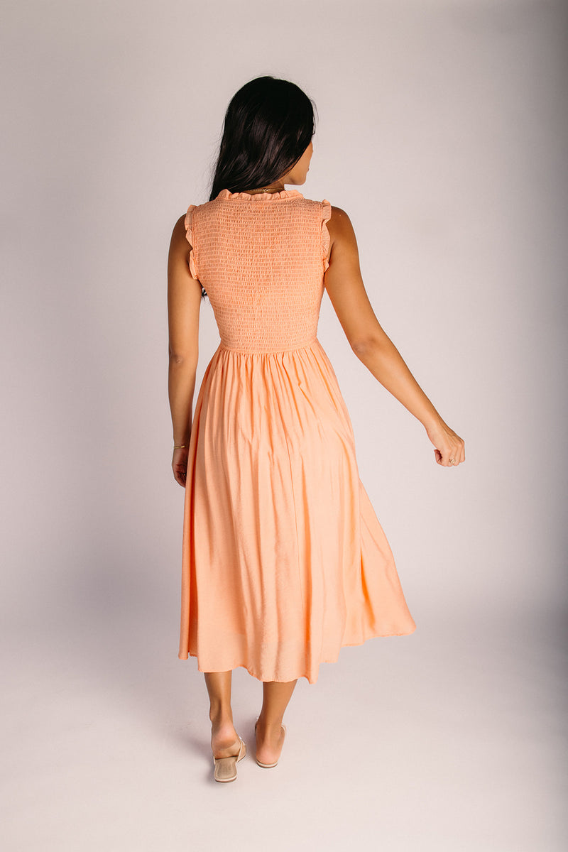 The Cordova Smocked Detail Midi Dress in Light Orange