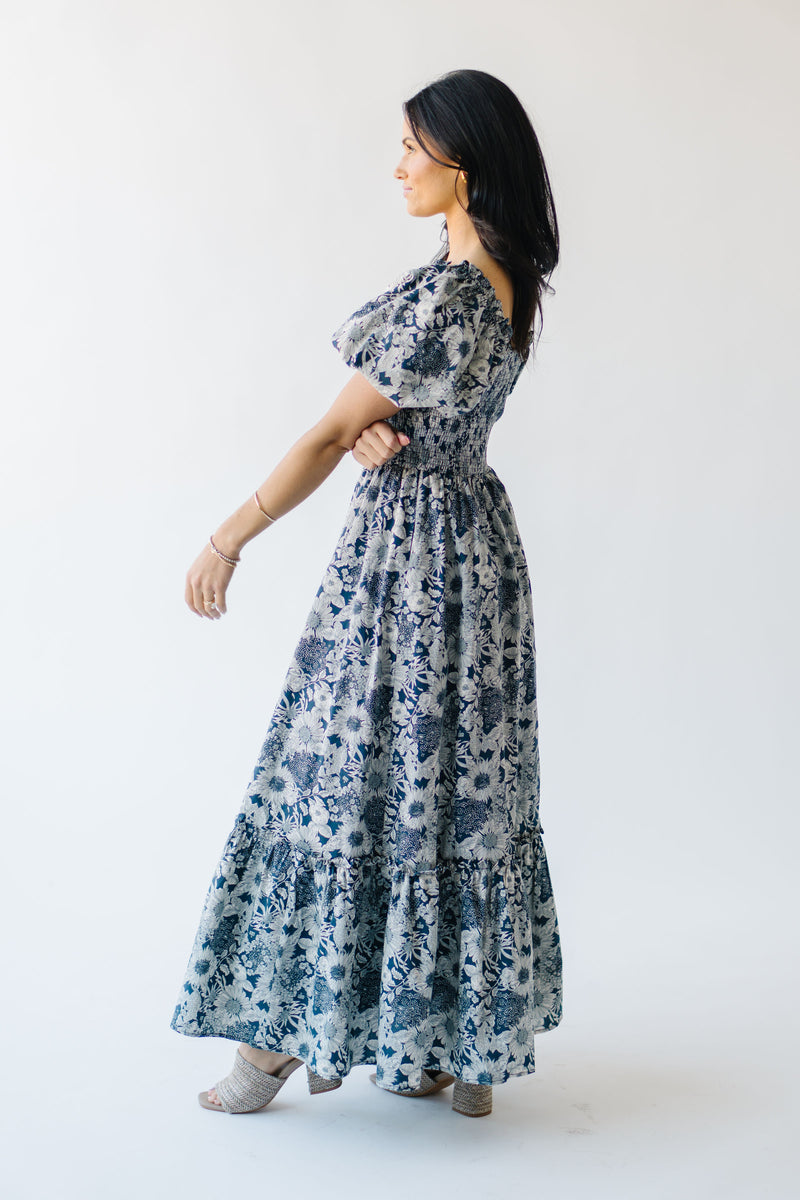 The Seaberg Smocked Midi Dress in Navy Floral