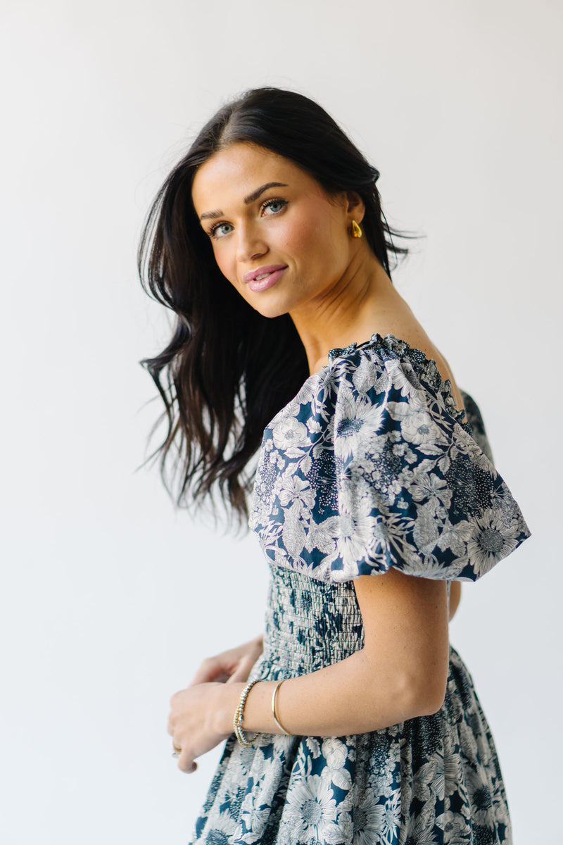 The Seaberg Smocked Midi Dress in Navy Floral