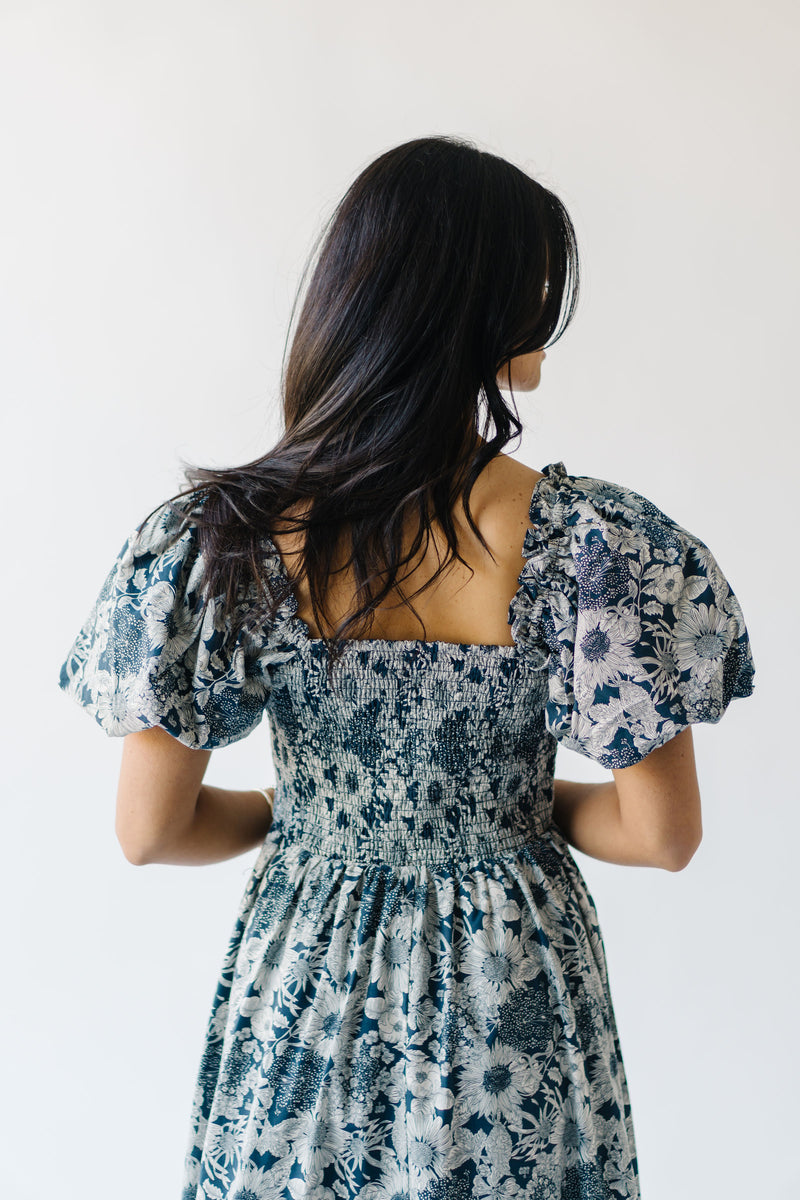 The Seaberg Smocked Midi Dress in Navy Floral