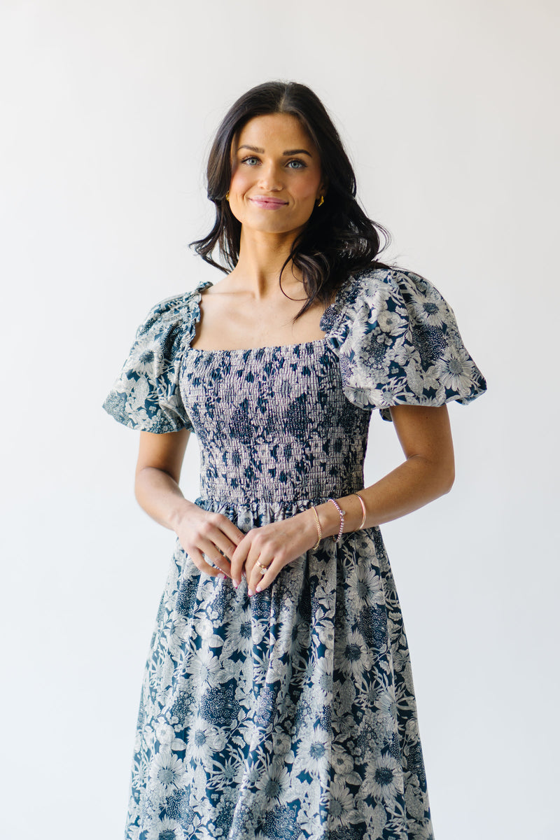 The Seaberg Smocked Midi Dress in Navy Floral