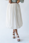 The Malson Crinkle Midi Skirt in Cream