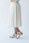 The Malson Crinkle Midi Skirt in Cream