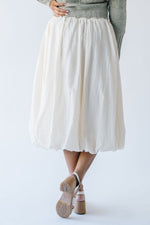 The Malson Crinkle Midi Skirt in Cream