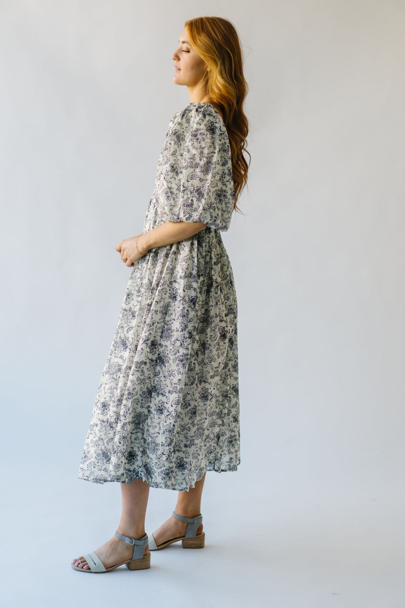 The Styron Puff Sleeve Midi Dress in Black Floral