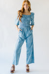 The Quintana Smocked Floral Jumpsuit in Denim