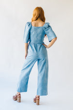 The Quintana Smocked Floral Jumpsuit in Denim