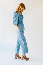 The Quintana Smocked Floral Jumpsuit in Denim