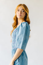 The Quintana Smocked Floral Jumpsuit in Denim