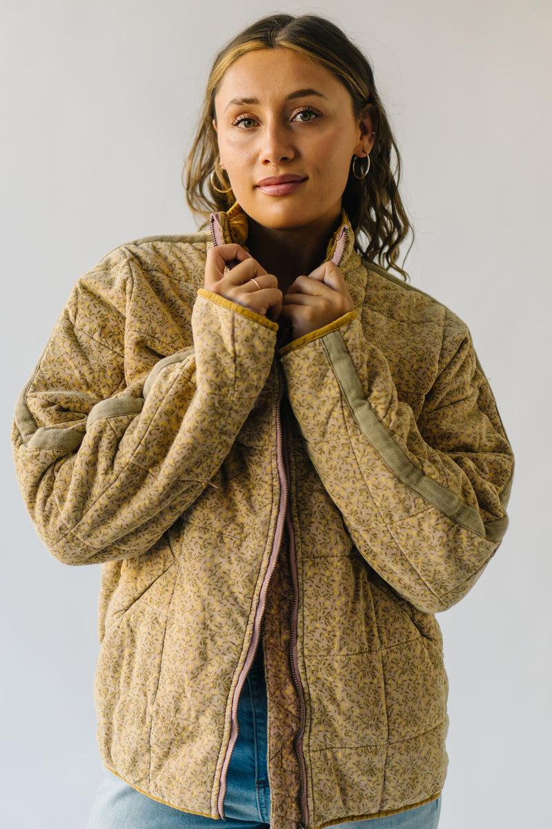 The Nukuri Quilted Corduroy Puffer Jacket in Dusty Mauve