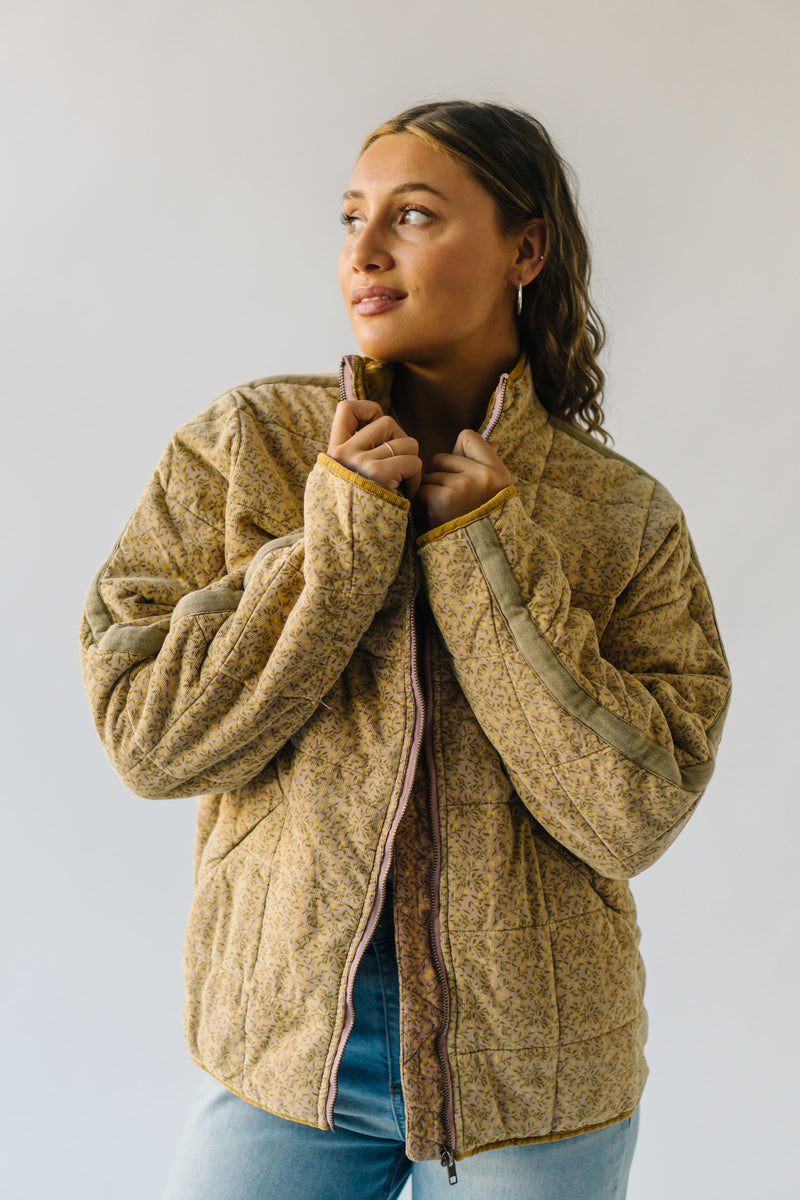 The Nukuri Quilted Corduroy Puffer Jacket in Dusty Mauve