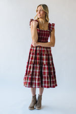 The Berglin Plaid Smocked Midi Dress in Cognac + Red