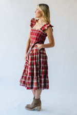 The Berglin Plaid Smocked Midi Dress in Cognac + Red