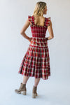 The Berglin Plaid Smocked Midi Dress in Cognac + Red