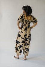 The Maggard Smocked Floral Jumpsuit in Taupe
