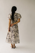 The Zembala Patterned Puff Sleeve Midi Dress in Black + Cream