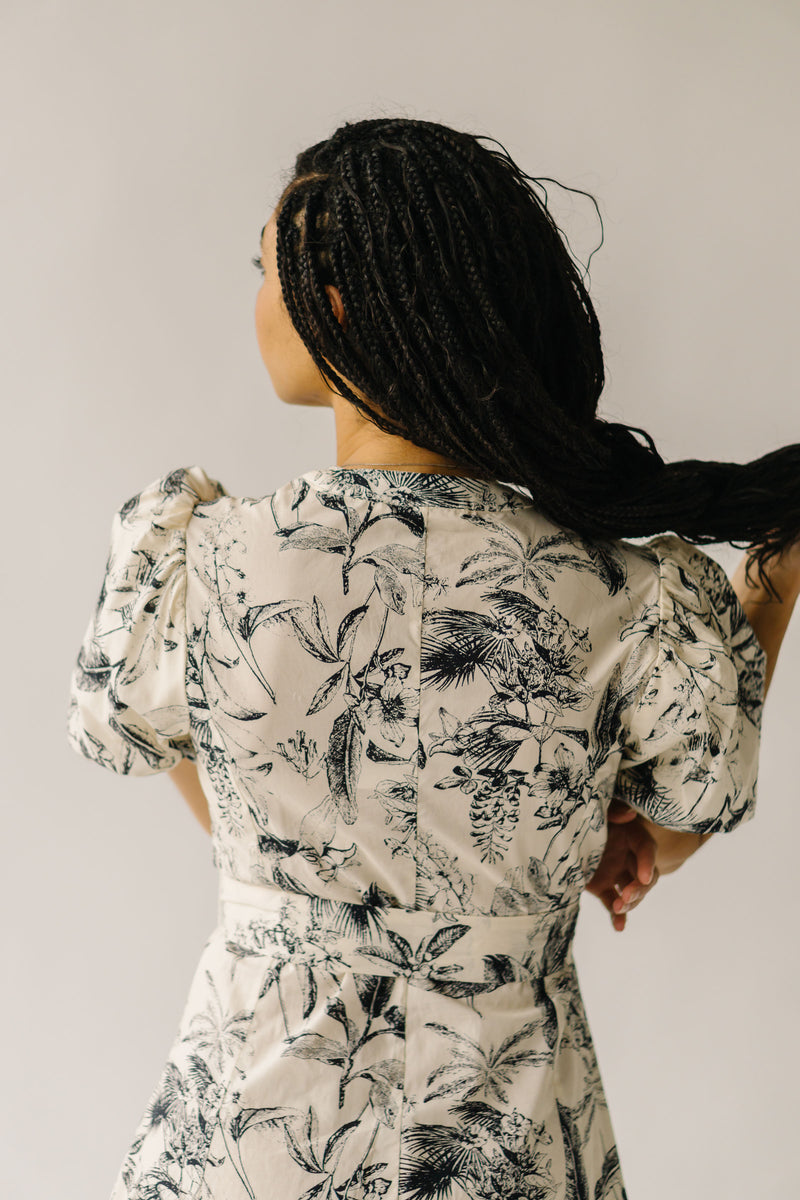 The Zembala Patterned Puff Sleeve Midi Dress in Black + Cream