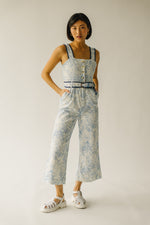 The Almada Belted Floral Jumpsuit in Ivory + Blue