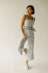 The Almada Belted Floral Jumpsuit in Ivory + Blue