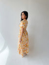 The Romero Floral Flutter Sleeve Maxi Dress in Yellow Multi