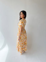 The Romero Floral Flutter Sleeve Maxi Dress in Yellow Multi
