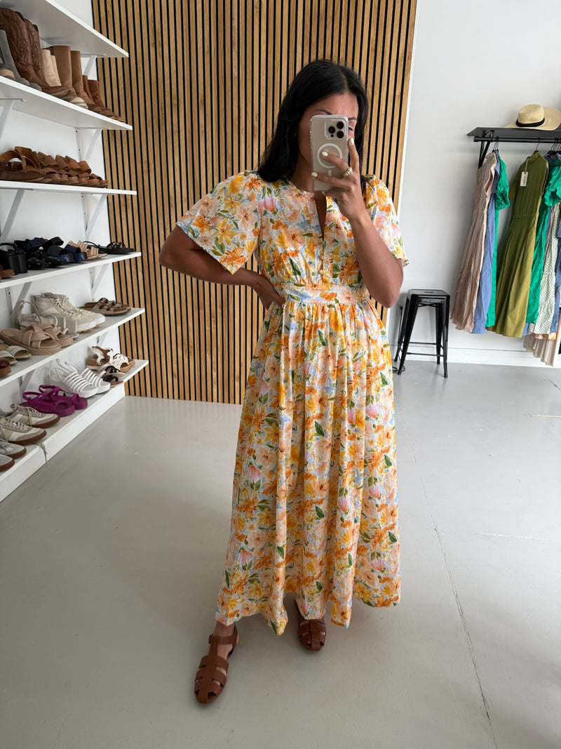 The Romero Floral Flutter Sleeve Maxi Dress in Yellow Multi