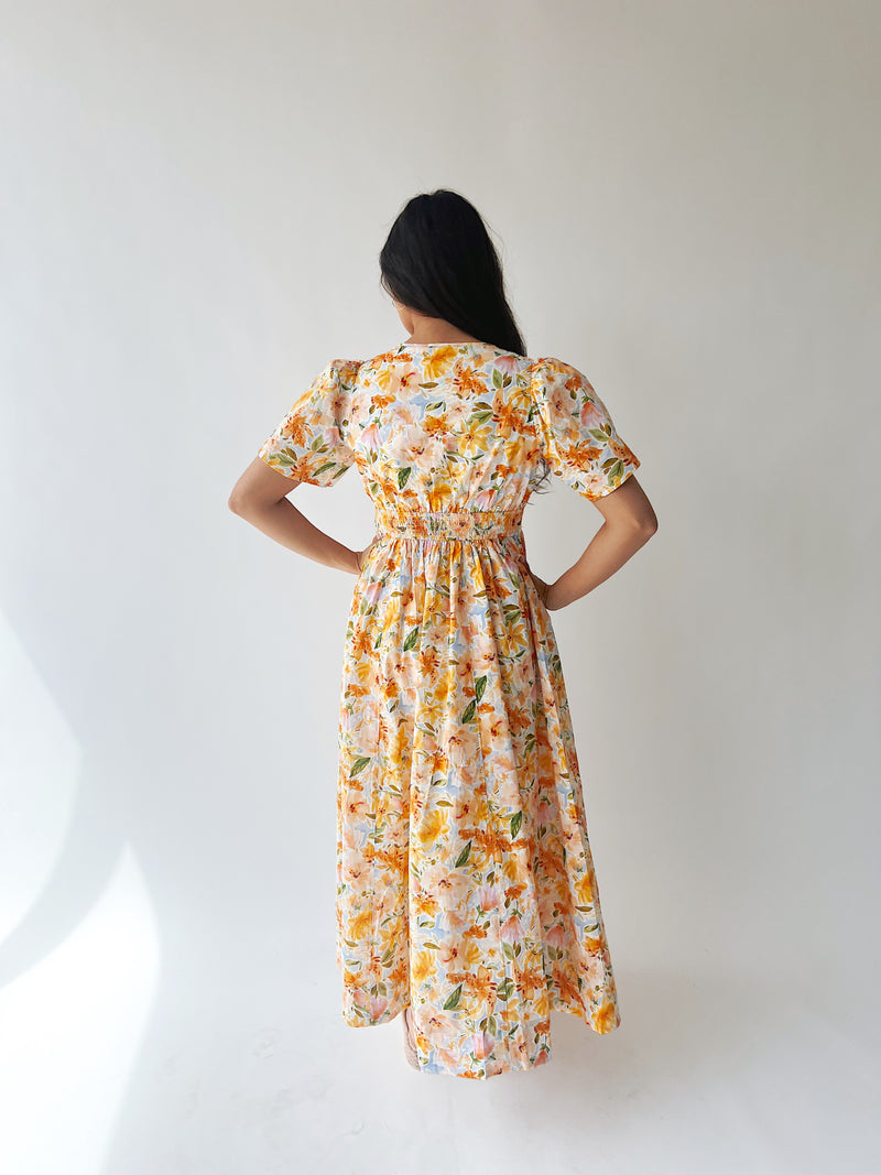 The Romero Floral Flutter Sleeve Maxi Dress in Yellow Multi