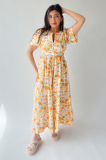 The Romero Floral Flutter Sleeve Maxi Dress in Yellow Multi