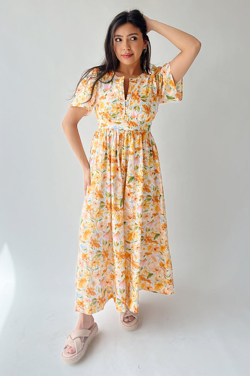 The Romero Floral Flutter Sleeve Maxi Dress in Yellow Multi