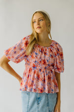 The Kinsella Floral Peplum Blouse in Peach Multi