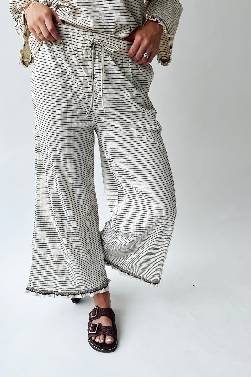 The Lyla Ruffle Edge Striped Pant in Cream + Brown