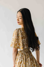 The Langston Flutter Sleeve Floral Maxi Dress in Antique Gold
