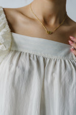 The Markelle Ruffle Sleeve Blouse in Off White