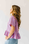The Rayne Ruffle Hem Striped Blouse in Purple + Pink