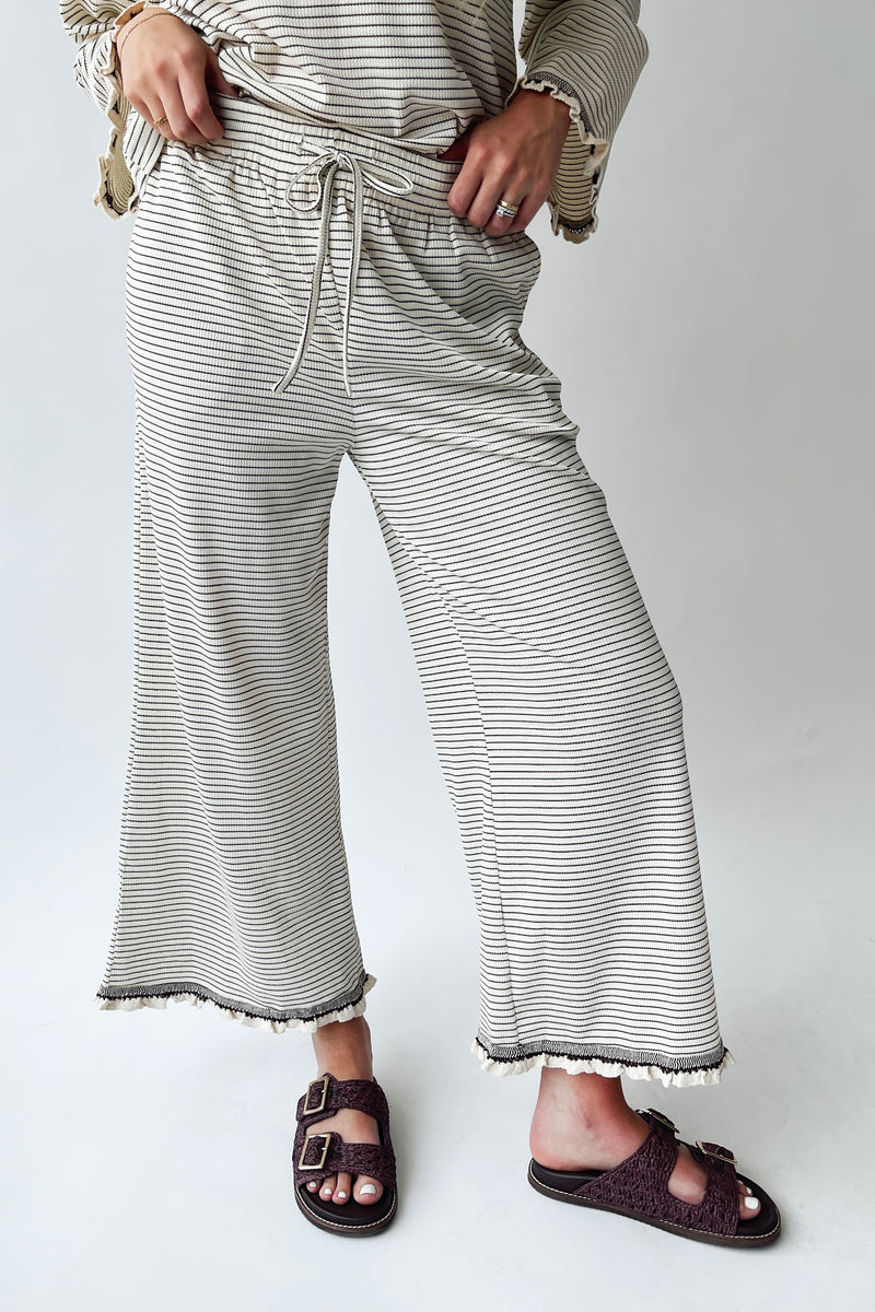 The Lyla Ruffle Edge Striped Pant in Cream + Brown