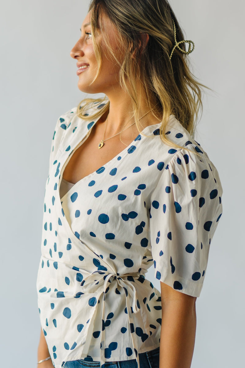 The Binford Dot Wrap Blouse in Cream