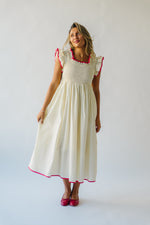 The Midgely Smocked Ruffle Detail Dress in Cream + Red