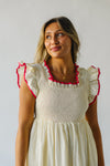 The Midgely Smocked Ruffle Detail Dress in Cream + Red