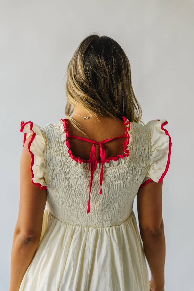 The Midgely Smocked Ruffle Detail Dress in Cream + Red