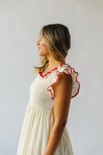 The Midgely Smocked Ruffle Detail Dress in Cream + Red