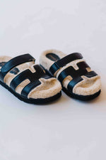 The Alpine Faux Shearling Sandal in Black