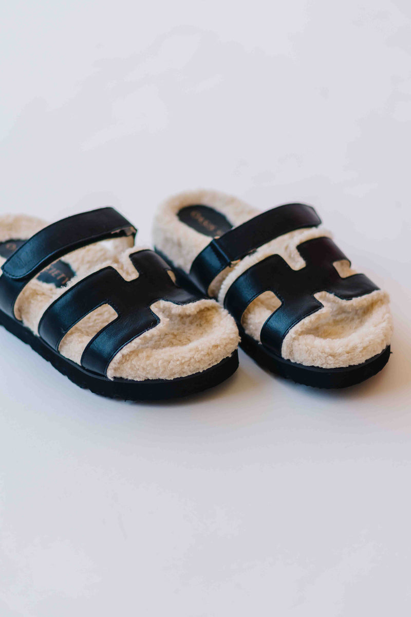 The Alpine Faux Shearling Sandal in Black