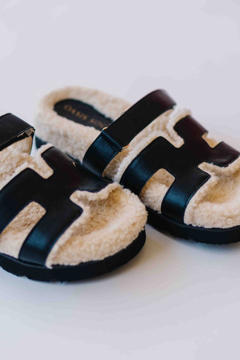The Alpine Faux Shearling Sandal in Black