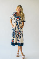 The Armada Puff Sleeve Satin Midi Dress in Navy Multi