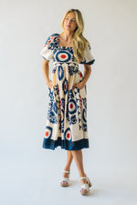 The Armada Puff Sleeve Satin Midi Dress in Navy Multi