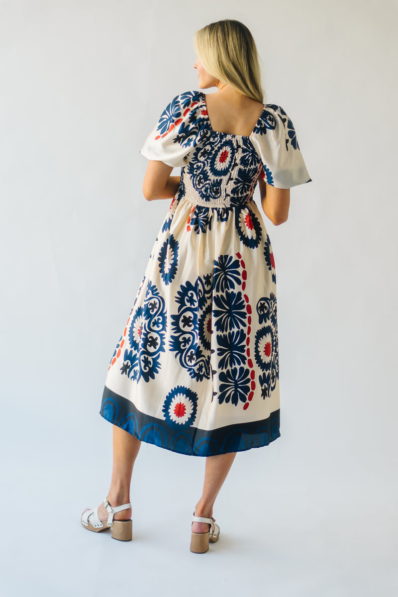 The Armada Puff Sleeve Satin Midi Dress in Navy Multi