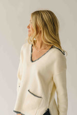 The Dollen Contrast Stitched Sweater in Ivory + Black